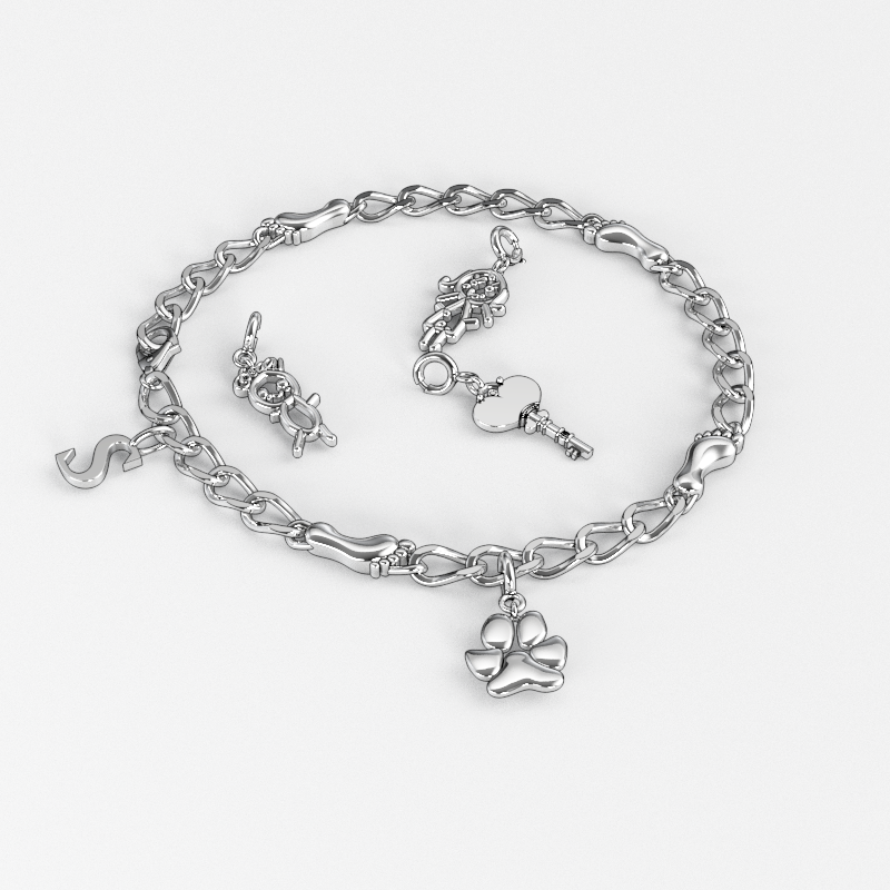 Silver bracelet with paw, key, and teddy bear charms displayed on a white background