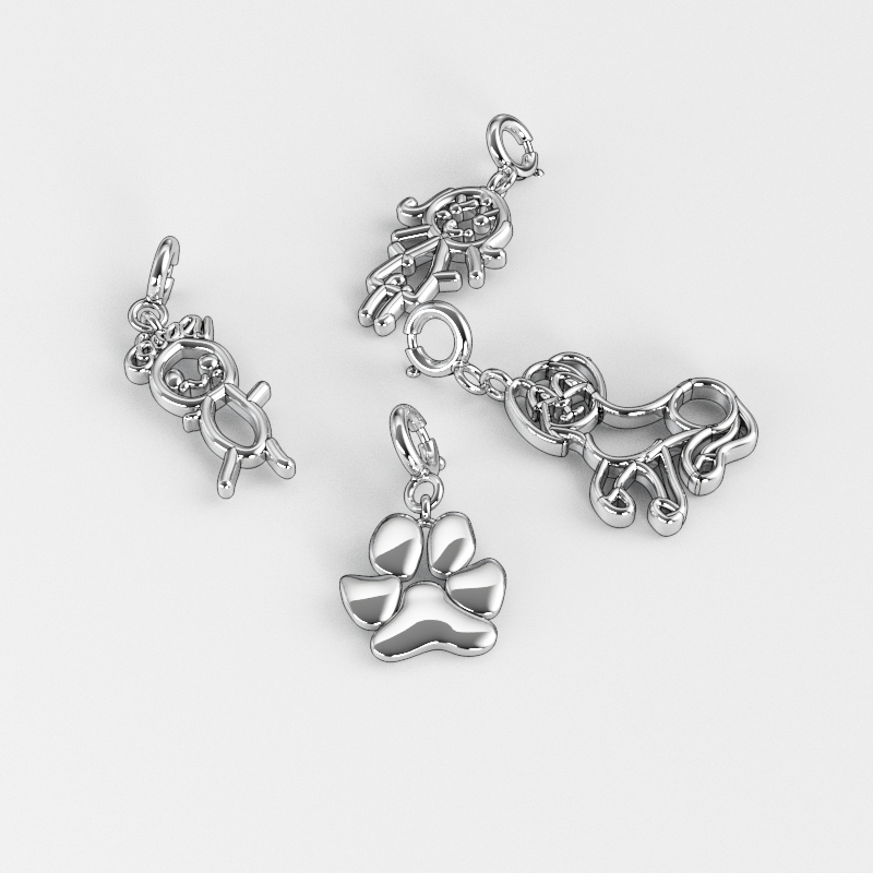 Custom silver charms set with paw print, teddy bear, and animal designs on a white background.