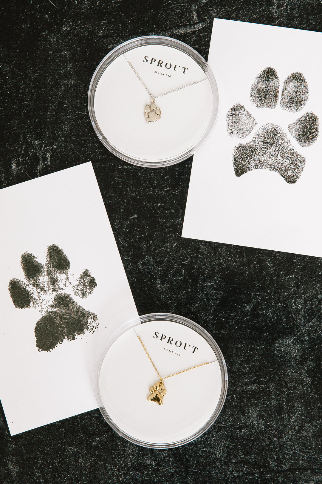 Pet paw print jewelry in silver and gold with matching ink paw prints