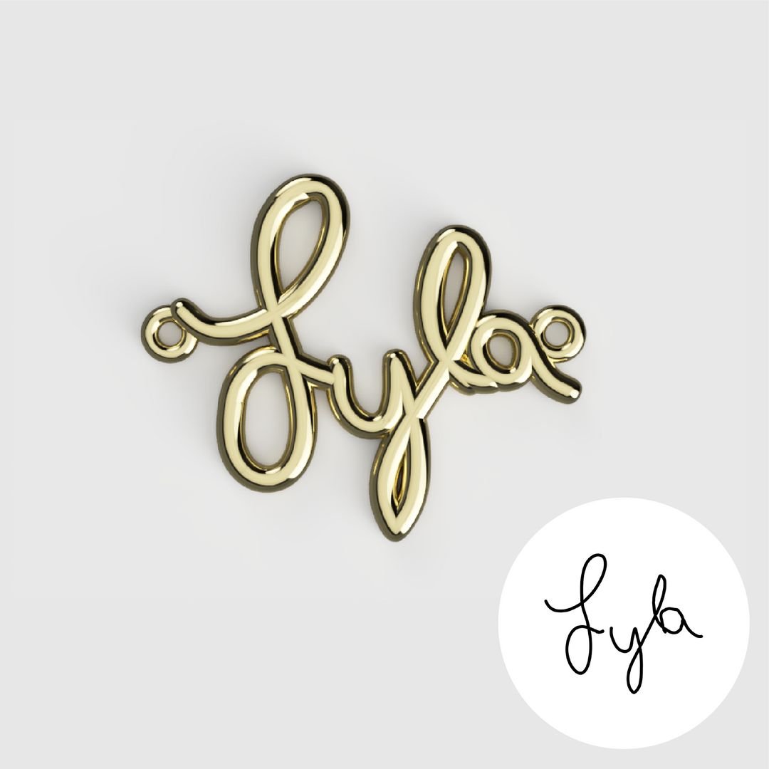 Gold custom handwriting pendant spelling “Lyla” with original handwriting reference.